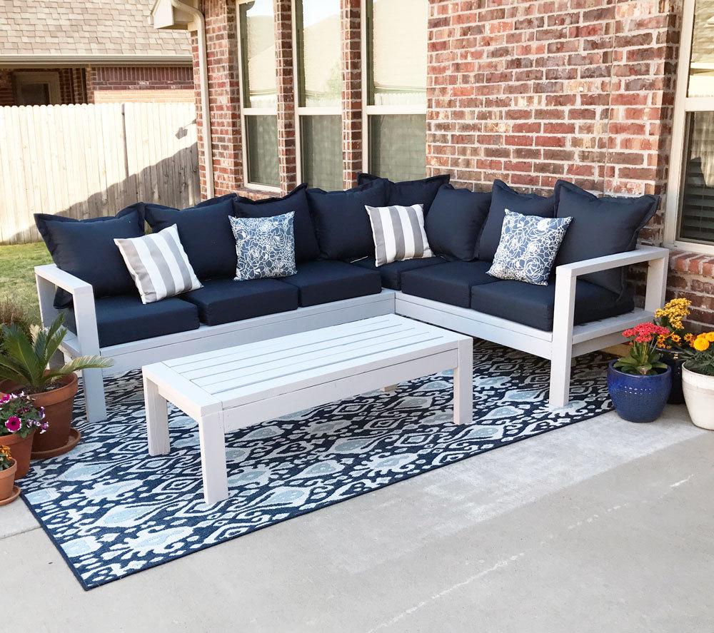outdoor sofa sectional made from 2x4s with blue cushions