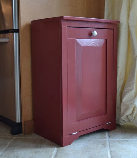 wood trash bin cabinet painted red with door closed