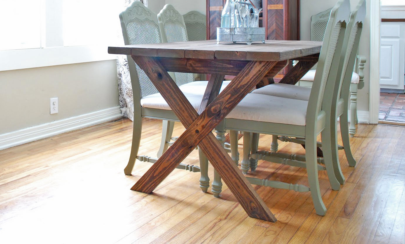 dark stained rustic X table in a pretty dining room