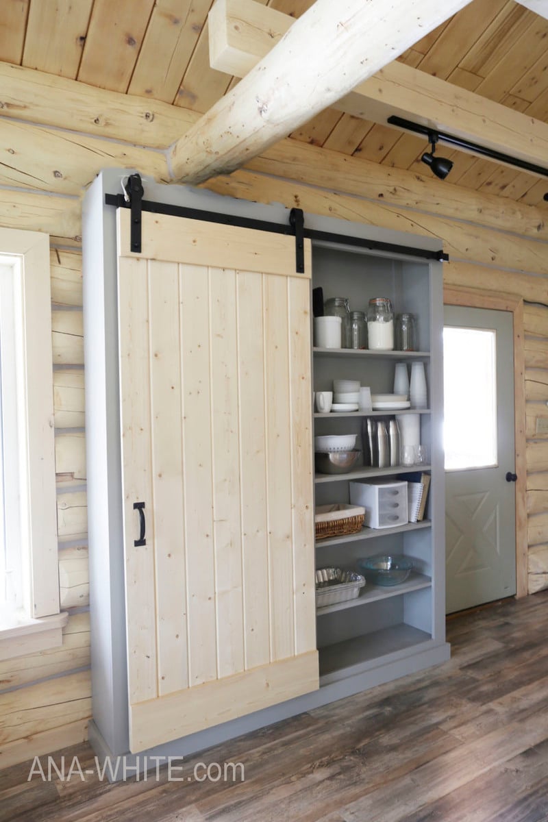 Walk In Closet with Plank Barn Door on Rails - Cottage - Closet