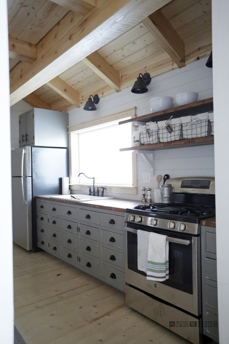Create a stunning DIY apothecary style kitchen cabinets with Ana White's easy-to-follow plans. These cabinets feature a vintage-inspired design with multiple small drawers, perfect for organizing spices, herbs, and other kitchen essentials in a stylish and functional way.