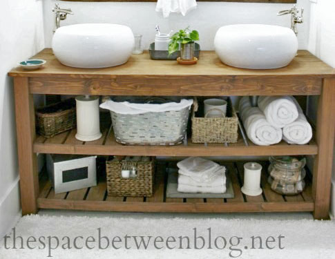 open shelf bathroom vanity with storage and white above mount sinks