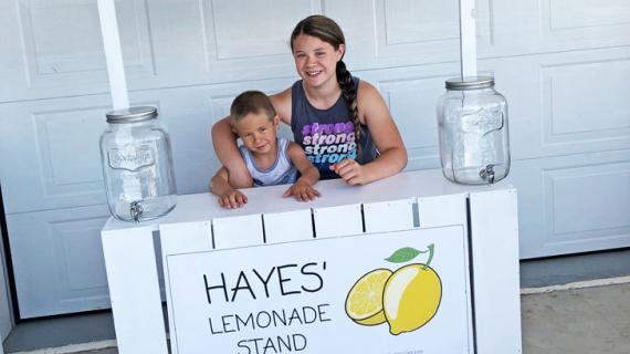 diy lemonade stand painted white with printable banner